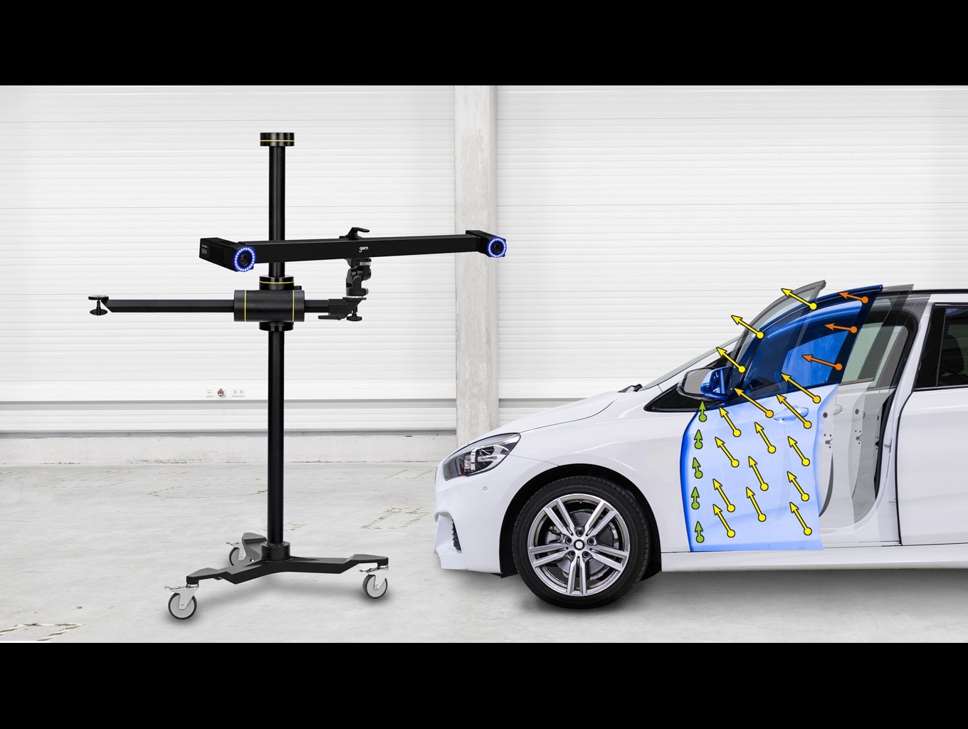 Telecamera ARAMIS 3D con cavalletto durante l’analisi di un’auto