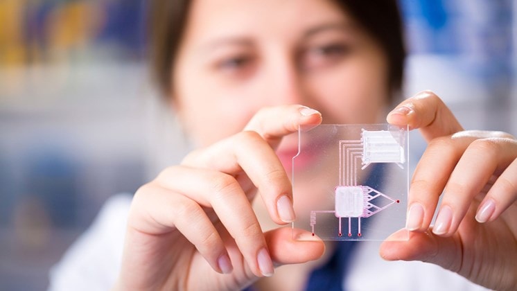 woman with LOC device (lab on chip)